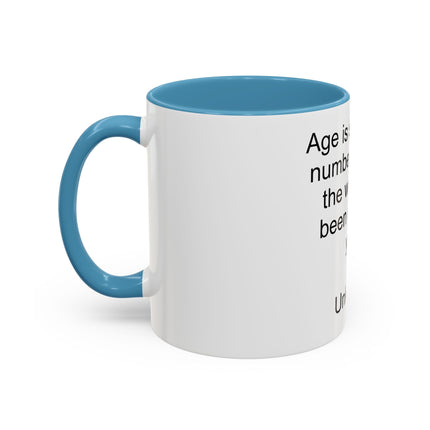 Accent Coffee Mug — "Age is simply the number of years the world has been enjoying you!" Inspirational Birthday Quote Mug