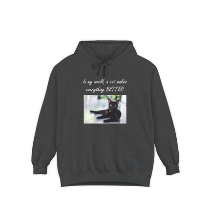 Garment‑dyed hoodie with relaxed black cat graphic and the quote “In my world, a cat makes everything better”