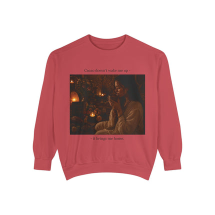Garment‑dyed sweatshirt featuring a warm candlelit photo of a cozy evening scene with steaming mugs