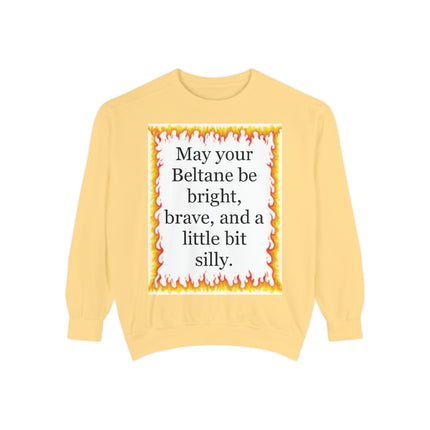 Garment‑dyed sweatshirt featuring a warm hand‑drawn flame border and the Beltane blessing “May your Beltane be bright, brave, and a little bit silly.”