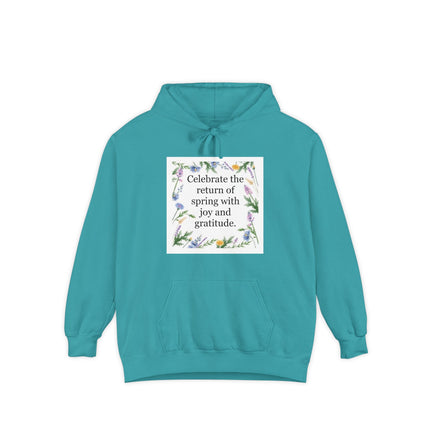 Garment‑dyed unisex hoodie with floral wreath and the quote “Celebrate the return of spring with joy and gratitude”