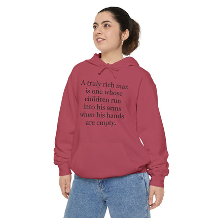 Quote Hoodie — "A truly rich man is one whose children run into his arms when his hands are empty"