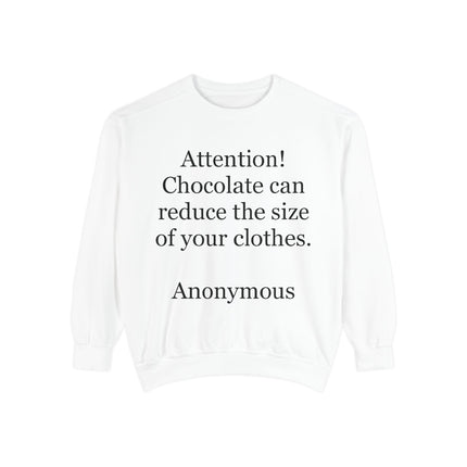 Garment‑dyed unisex sweatshirt with the humorous quote “Attention! Chocolate can reduce the size of your clothes” printed on the front