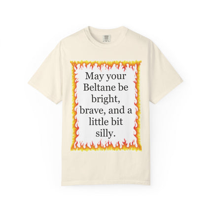 Garment‑dyed tee with a festive flame border and the playful Beltane blessing “May your Beltane be bright, brave, and a little bit silly.”
