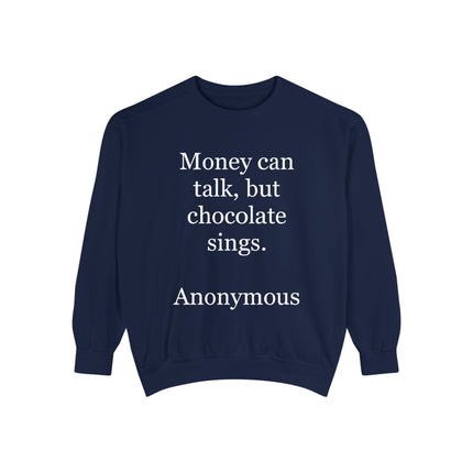 Garment‑dyed unisex sweatshirt with bold text reading “Money can talk, but chocolate sings” printed on the front