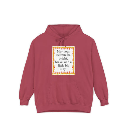 Garment‑dyed hoodie with a festive flame border and the Beltane blessing “May your Beltane be bright, brave, and a little bit silly.”