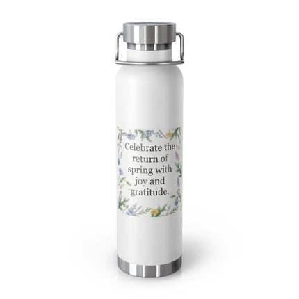 22oz insulated stainless steel bottle with floral wreath and the quote “Celebrate the return of spring with joy and gratitude”