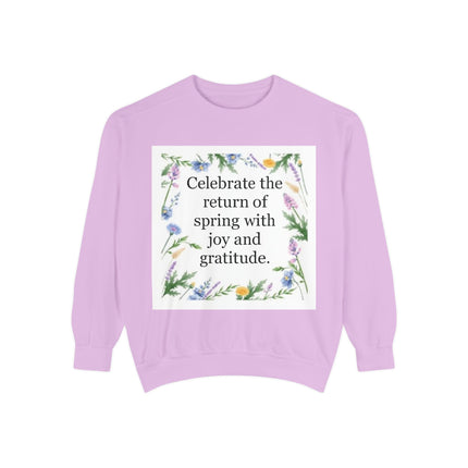 Garment‑dyed unisex sweatshirt with floral wreath and the quote “Celebrate the return of spring with joy and gratitude”