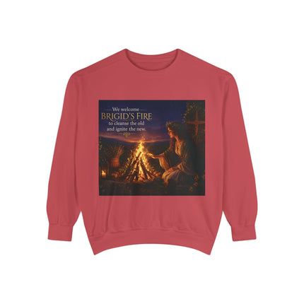 Garment‑dyed sweatshirt featuring a warm illustration of Brigid tending an Imbolc ritual fire