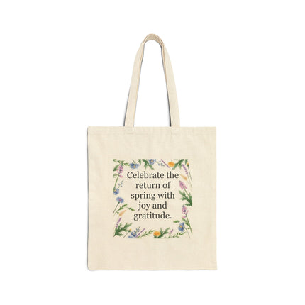 Natural cotton canvas tote with floral wreath and the quote “Celebrate the return of spring with joy and gratitude”